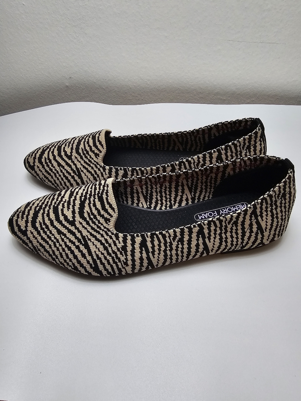 Skechers Women's Slip-On Zebra-Print Flats in Beige and Black